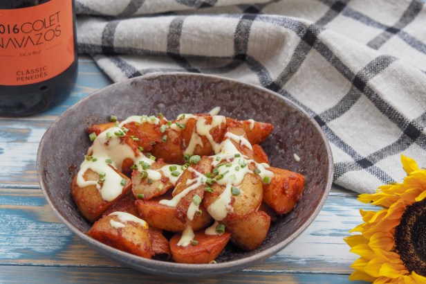 Take your aperitivo to the next level with spicy patatas bravas and a glass of Colet Navazos Cava